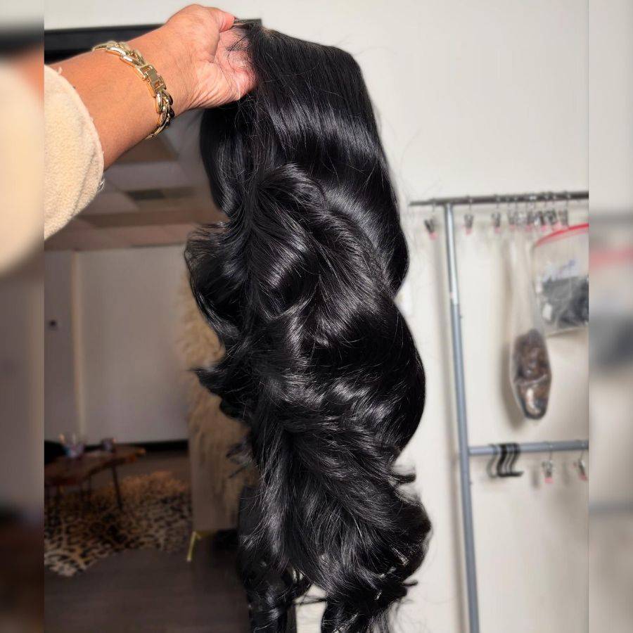 Close-up of jet black body wave wig showing thick 250% density and soft texture, perfect for 13X6 HD lace front styling.