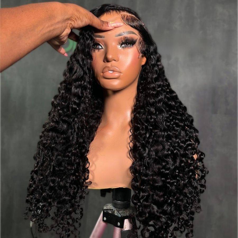 Hand styling WOWANGEL Burmese Curl Glueless Lace Front Wig on mannequin, emphasizing realistic curls and HD lace frontal design.