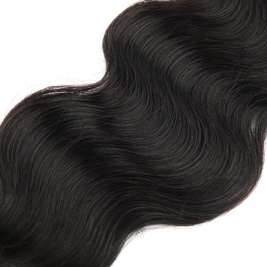 Close-up of body wave Burmese virgin hair extension, emphasizing its soft texture and elegant wave pattern.