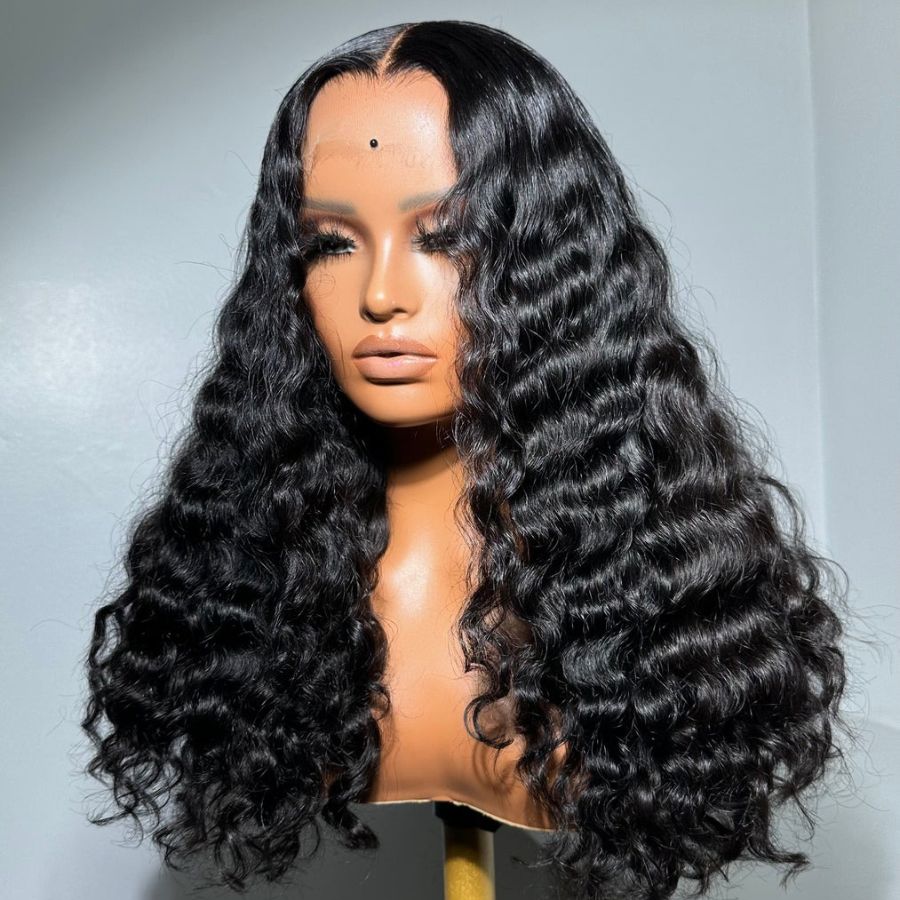 Burmese Wave HD Lace Closure Wig with natural curls, made from 100% human hair. Pre-plucked with bleached knots for a seamless and realistic look.