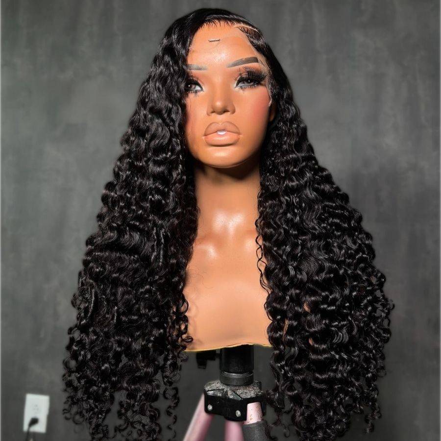Frontal view of WOWANGEL Burmese Curl Glueless Lace Front Wig with voluminous curls and pre-plucked hairline on display mannequin.