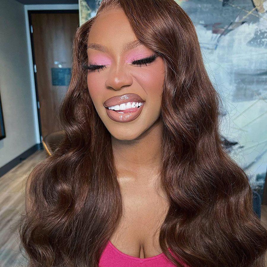 Smiling model with WOWANGEL brown body wave wig