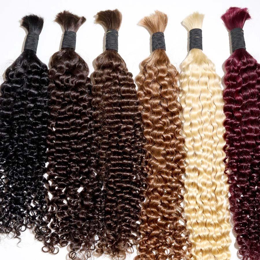 Close-up of curly human hair bundles in multiple shades.