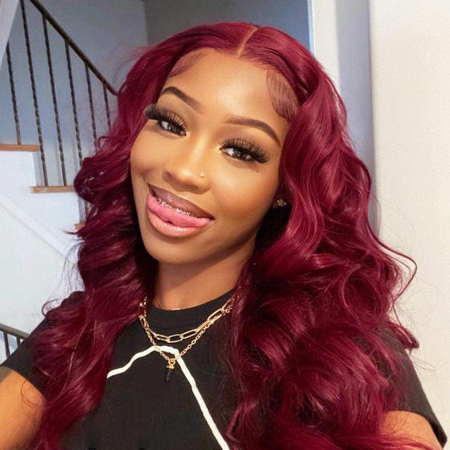 Model smiling with WOWANGEL plum red HD lace wig, curly style.