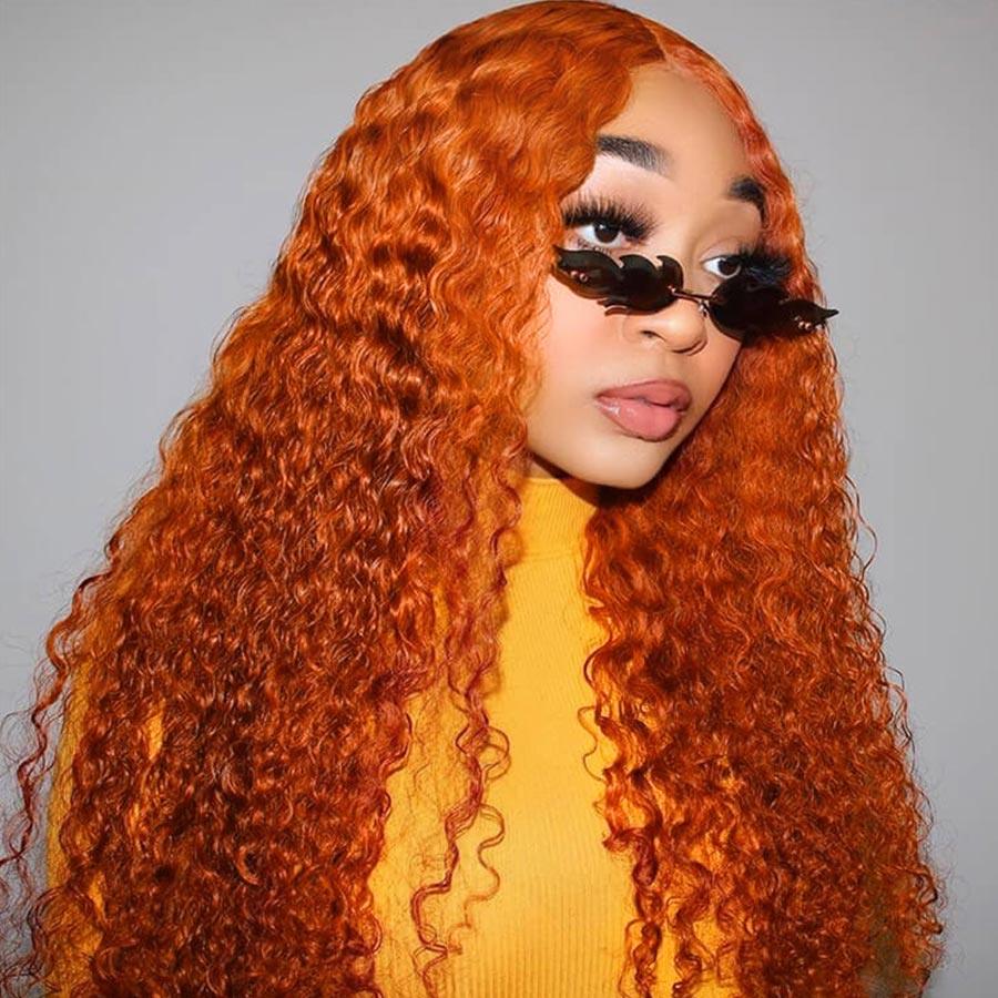 Model wearing ginger orange curly wig with sunglasses