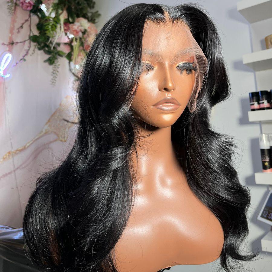 Jet black HD lace frontal wig on mannequin, body wave style