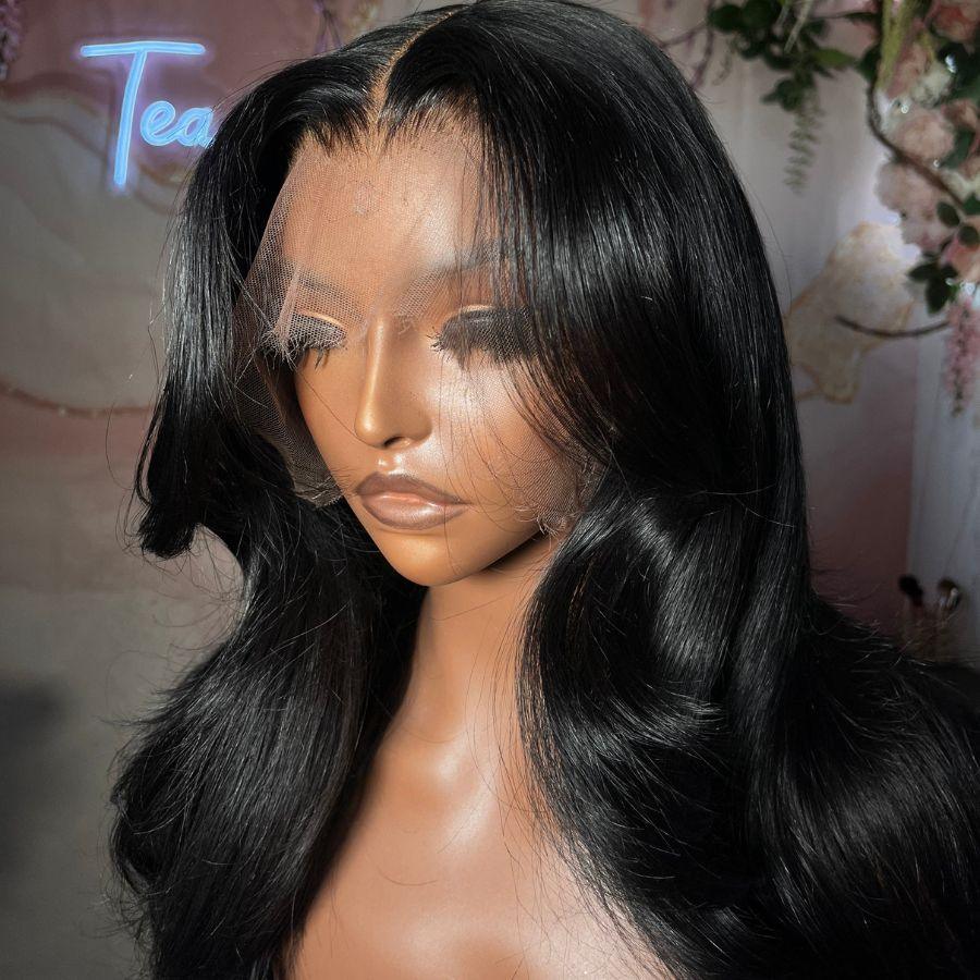 Side view of jet black HD lace wig, body wave on mannequin