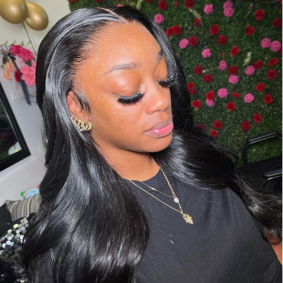 Woman wearing WOWANGEL jet black HD lace front wig