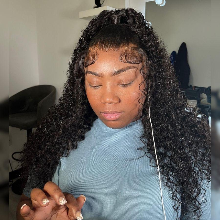 Woman wearing WOWANGEL curly full lace wig